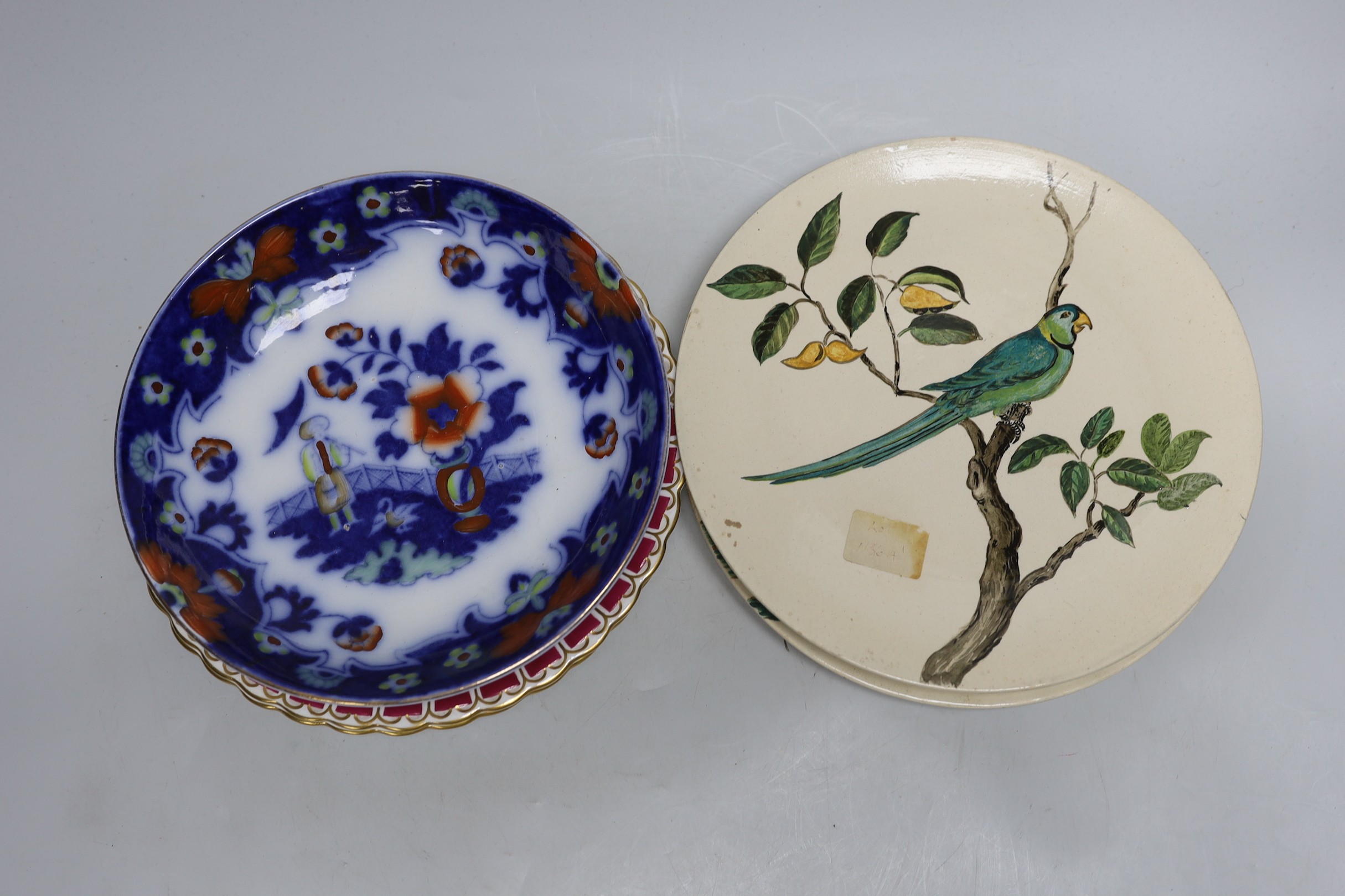 A pair of Doulton plates, a pair of floral plates, a Victorian nursery plate and a large flow blue cup and saucer